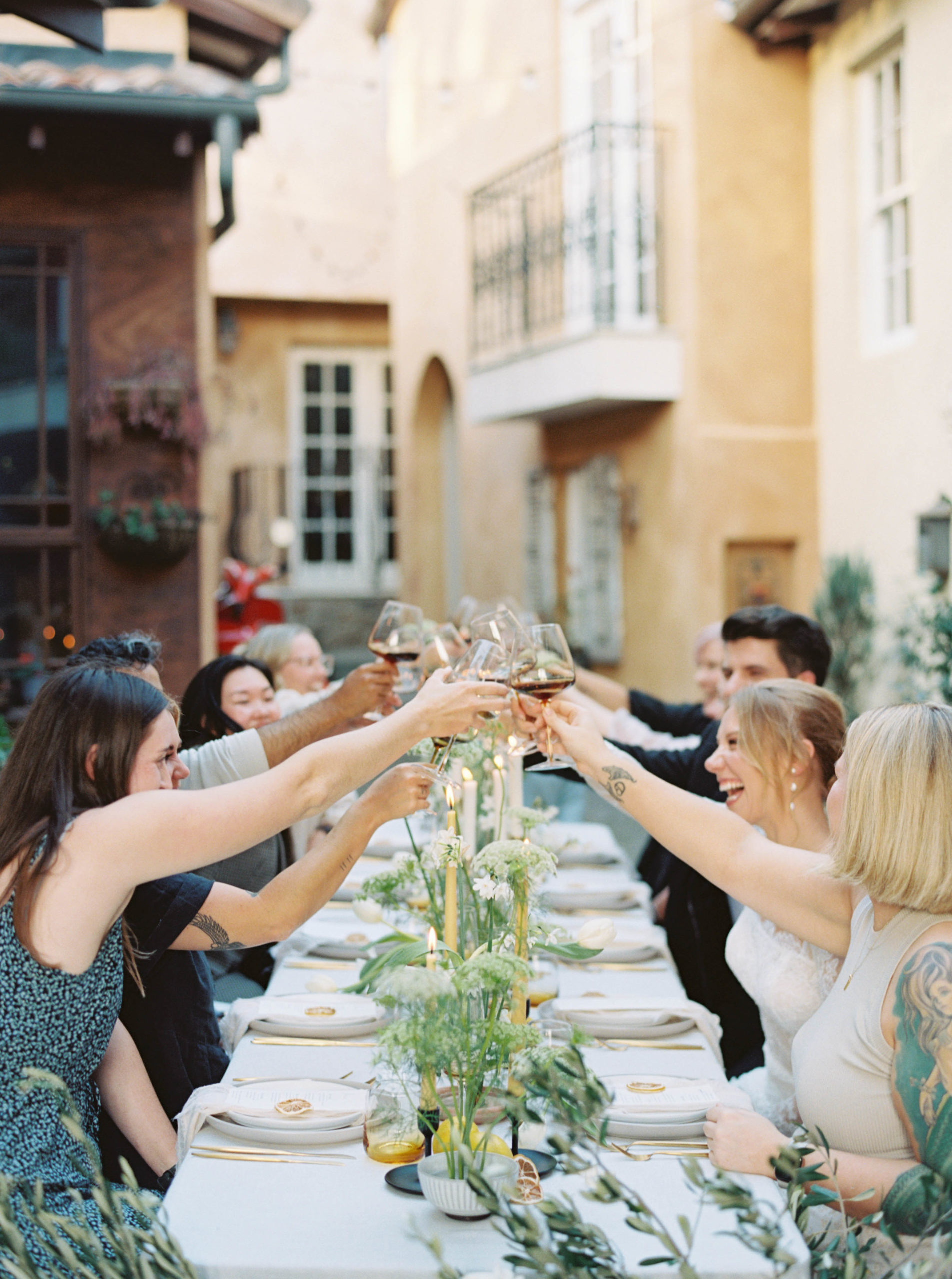 Luxury Fine Art Film Destination wedding photographer in a Tuscany Italy Villa with bride and groom at alfresco wedding table style